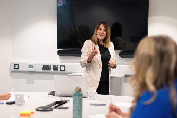 Wellbeing expert leads a Mental Health training session in a classroom.
